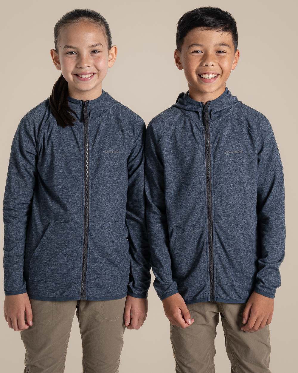 Blue Navy Marl Coloured Craghoppers Kids Nosi Life Frey Hooded Jacket on Beige Background 