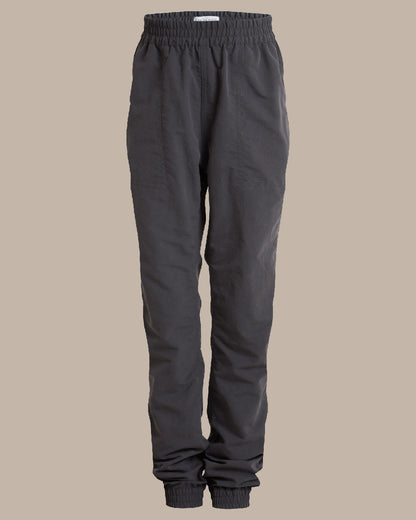 Black Pepper Coloured Craghoppers Kids Nosilife Pinzon Trousers on Beige Background 