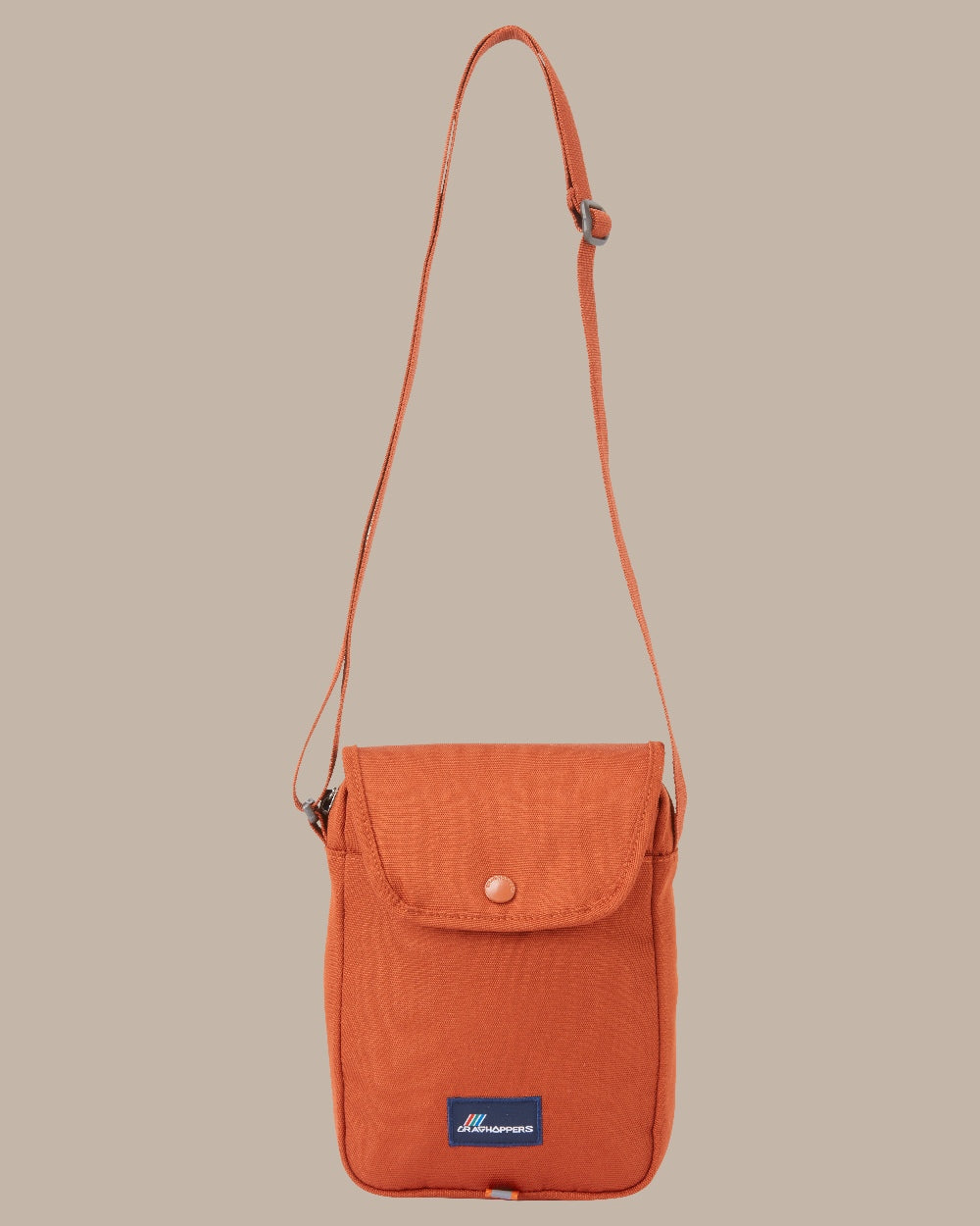 Red Beach Coloured Craghoppers Kiwi Crossbody II on Beige Background 