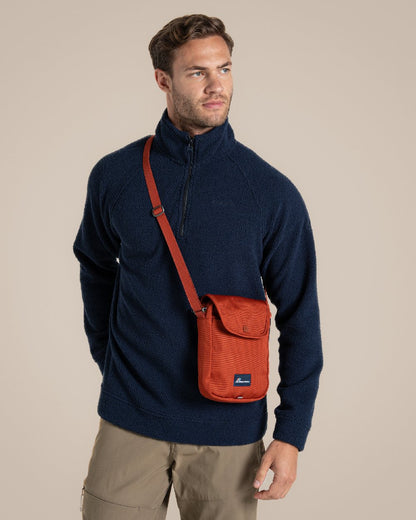 Red Beach Coloured Craghoppers Kiwi Crossbody II on Beige Background 