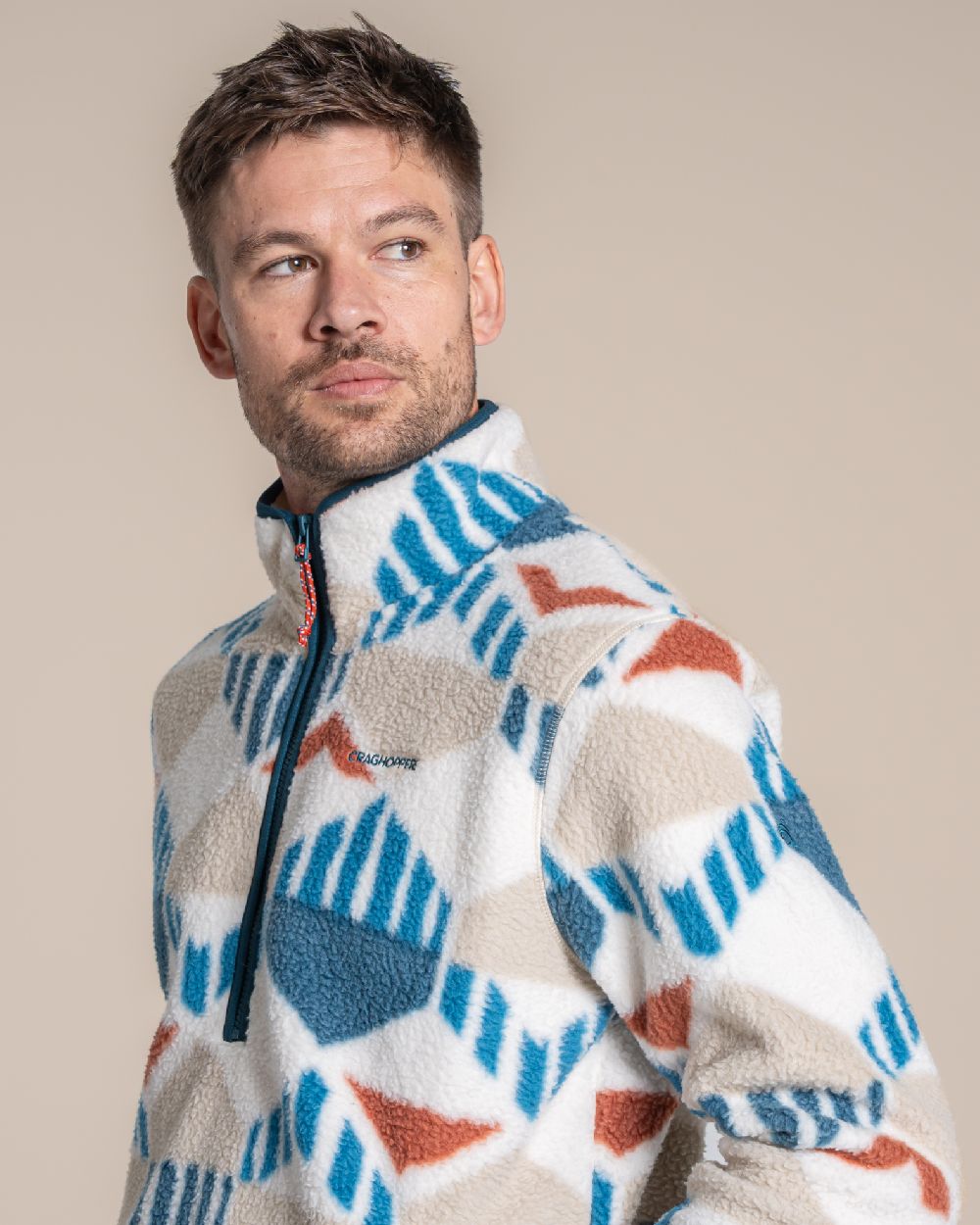River Blue coloured Craghoppers Mens Tatton II Half Zip on beige background 
