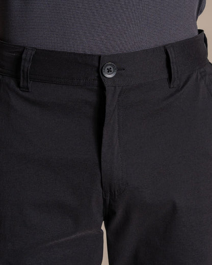 Black coloured Craghoppers Mens Brisk Pro Trouser on beige background 