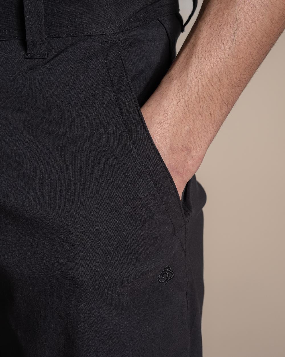 Black coloured Craghoppers Mens Brisk Pro Trouser on beige background 
