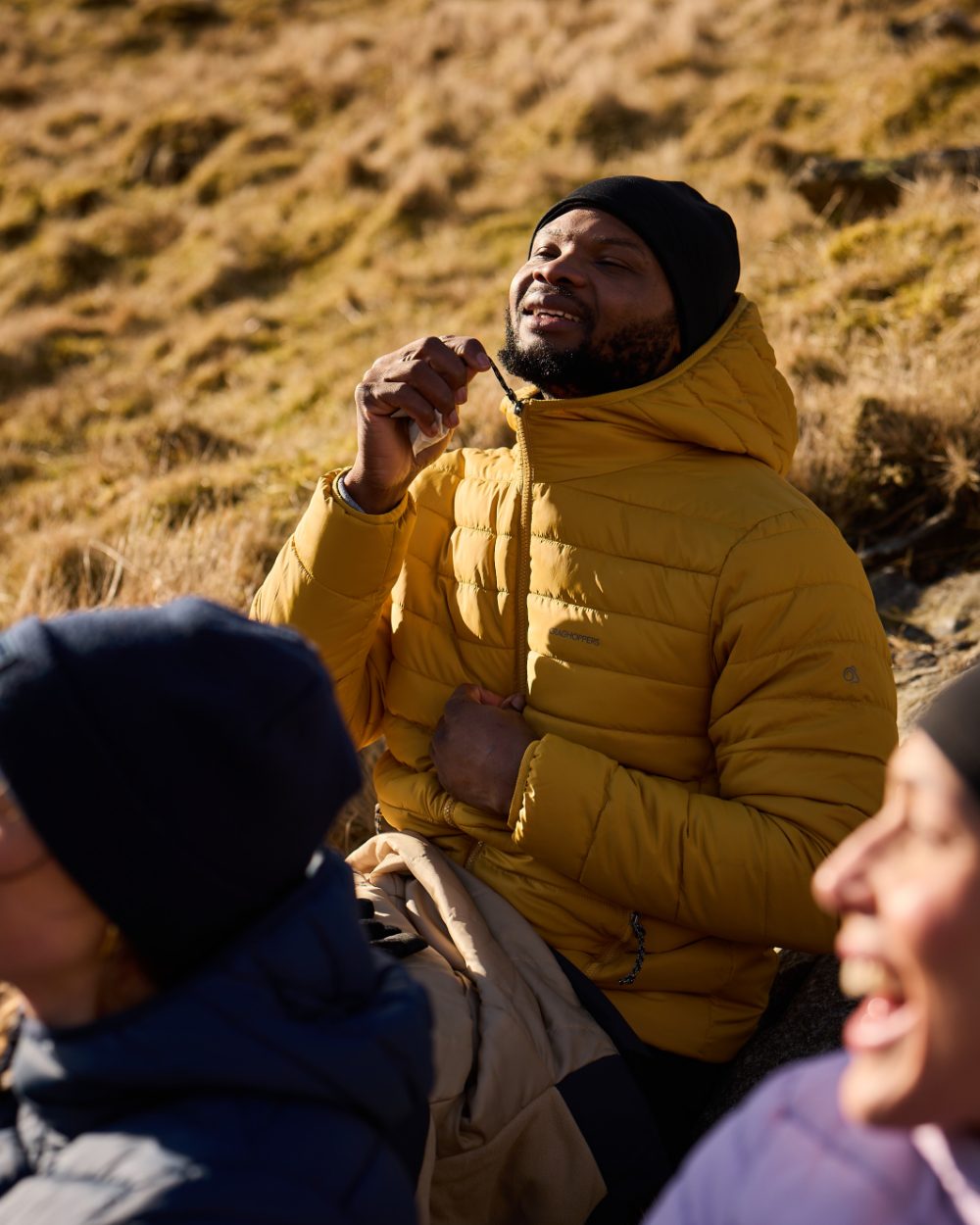 Beeswax coloured Craghoppers Mens Compresslite IX Hooded Insulating Jacket on mountain background 