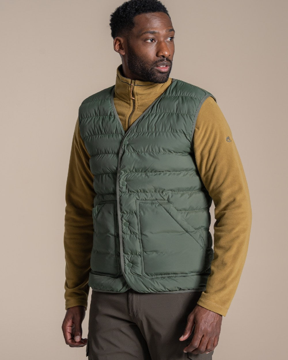 Lagano Green coloured Craghoppers Mens Dalesway Vest on beige background 