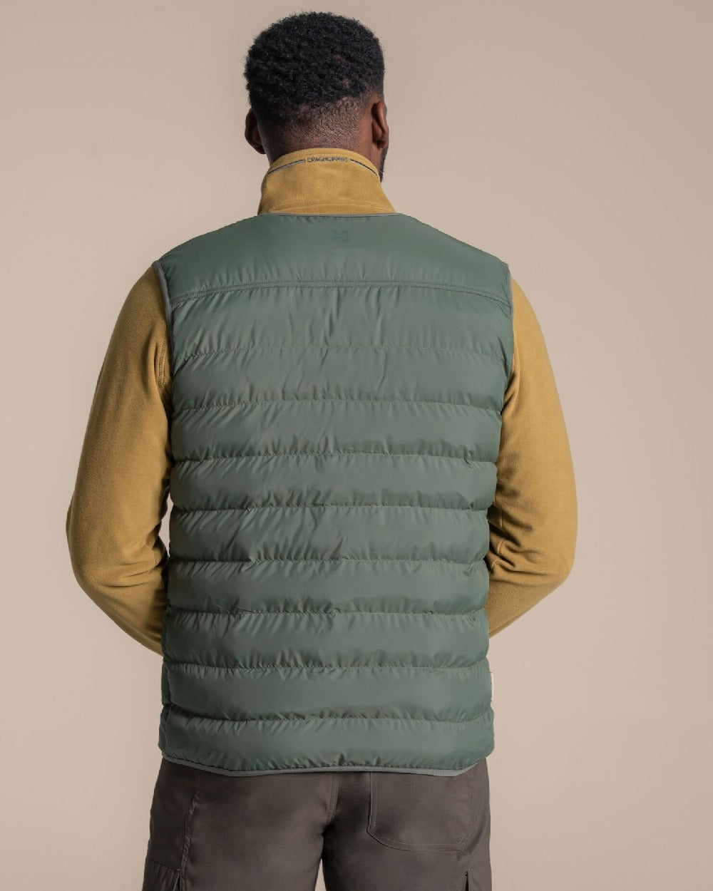 Lagano Green coloured Craghoppers Mens Dalesway Vest on beige background 