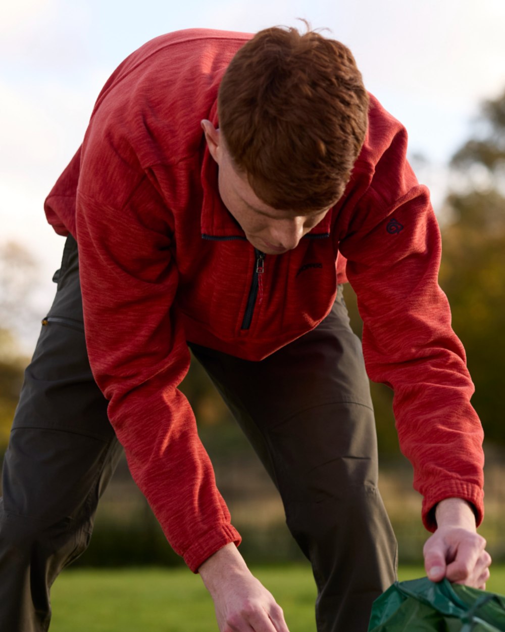 Pimento Red coloured Craghoppers Mens Esk Half Zip Fleece on outdoor background 