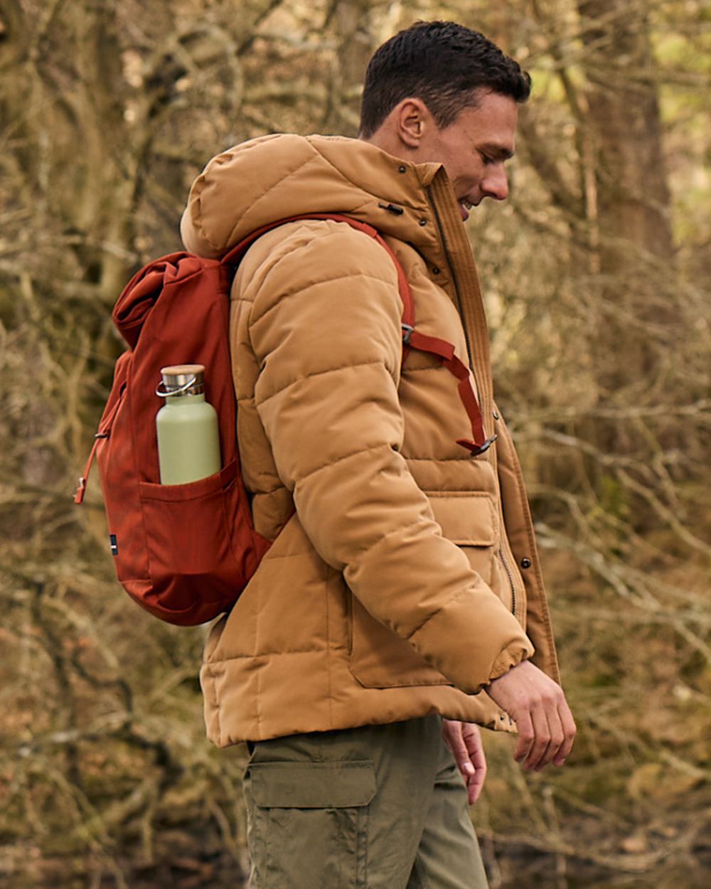 Boulder coloured Craghoppers Mens Howgill Downlike Hooded Jacket on forest background 