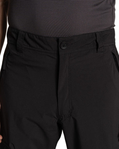 Black coloured Craghoppers Mens Indus Waterproof Lightweight Cargo Trousers on white background 
