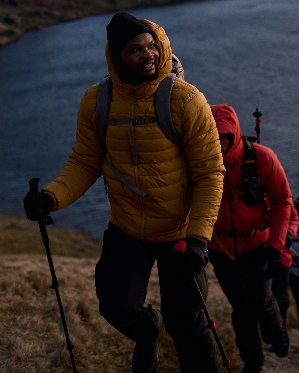 Black coloured Craghoppers Mens Indus Waterproof Lightweight Cargo Trousers on mountain background 