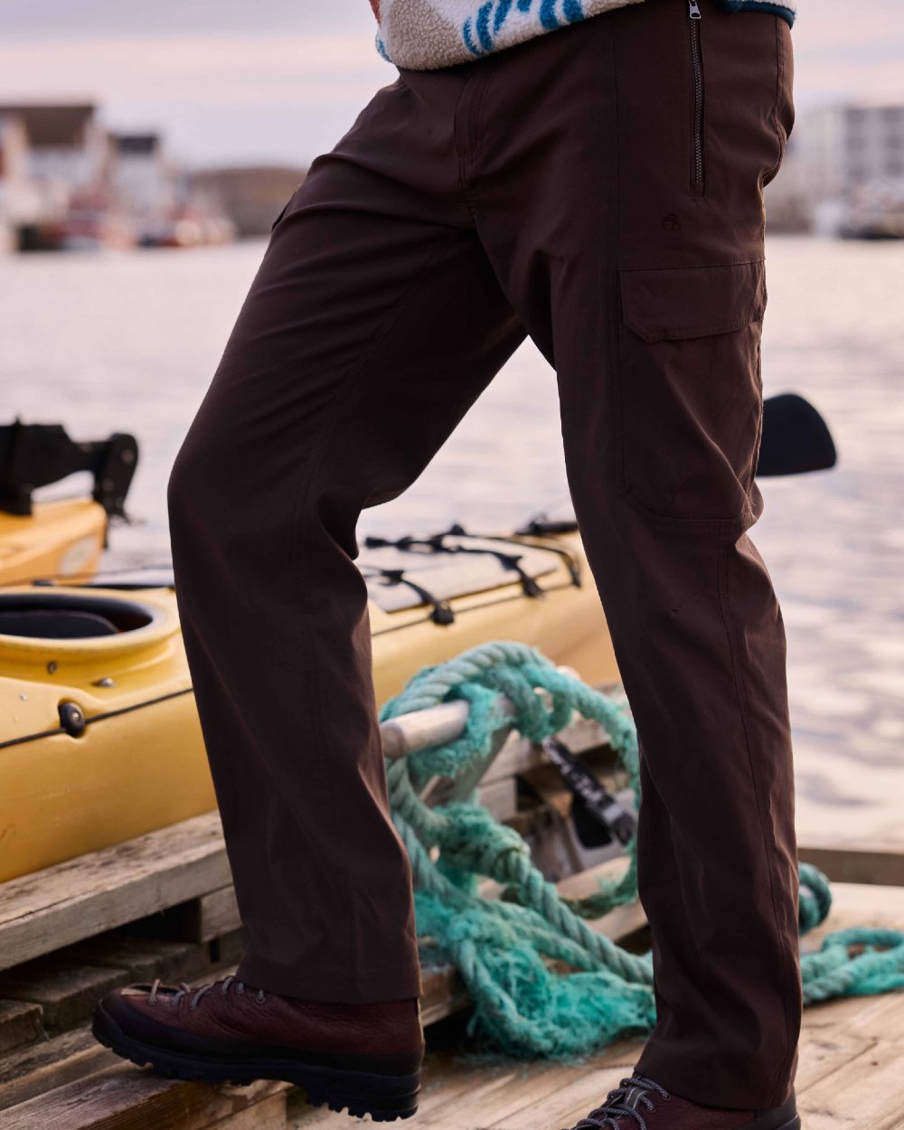 Wenge Brown coloured Craghoppers Mens Kiwi Pro Cargo Trousers on sea background 