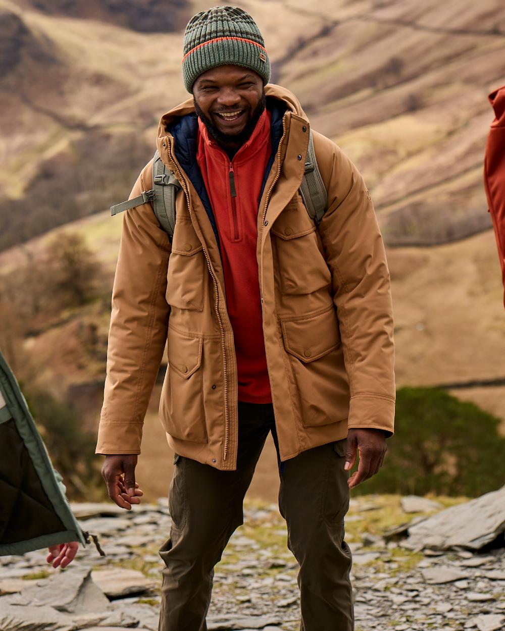 Woodland Green coloured Craghoppers Mens Kiwi Pro Cargo Trousers on mountain background 