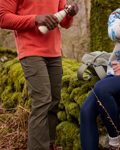 Woodland Green coloured Craghoppers Mens Kiwi Pro Cargo Trousers on mountain background 
