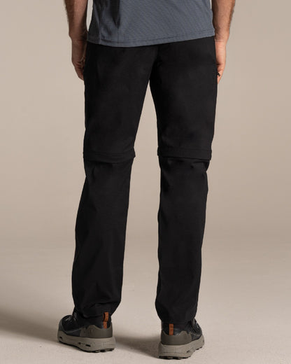 Black Coloured Craghoppers Mens Kiwi Pro III Convertible Trouser on Beige Background 
