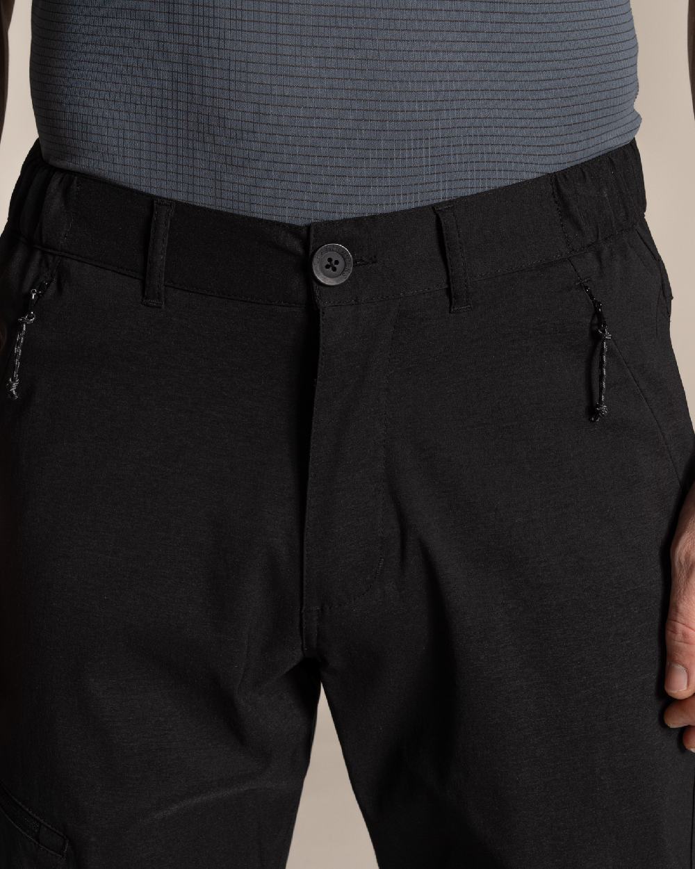 Black Coloured Craghoppers Mens Kiwi Pro III Convertible Trouser on Beige Background 