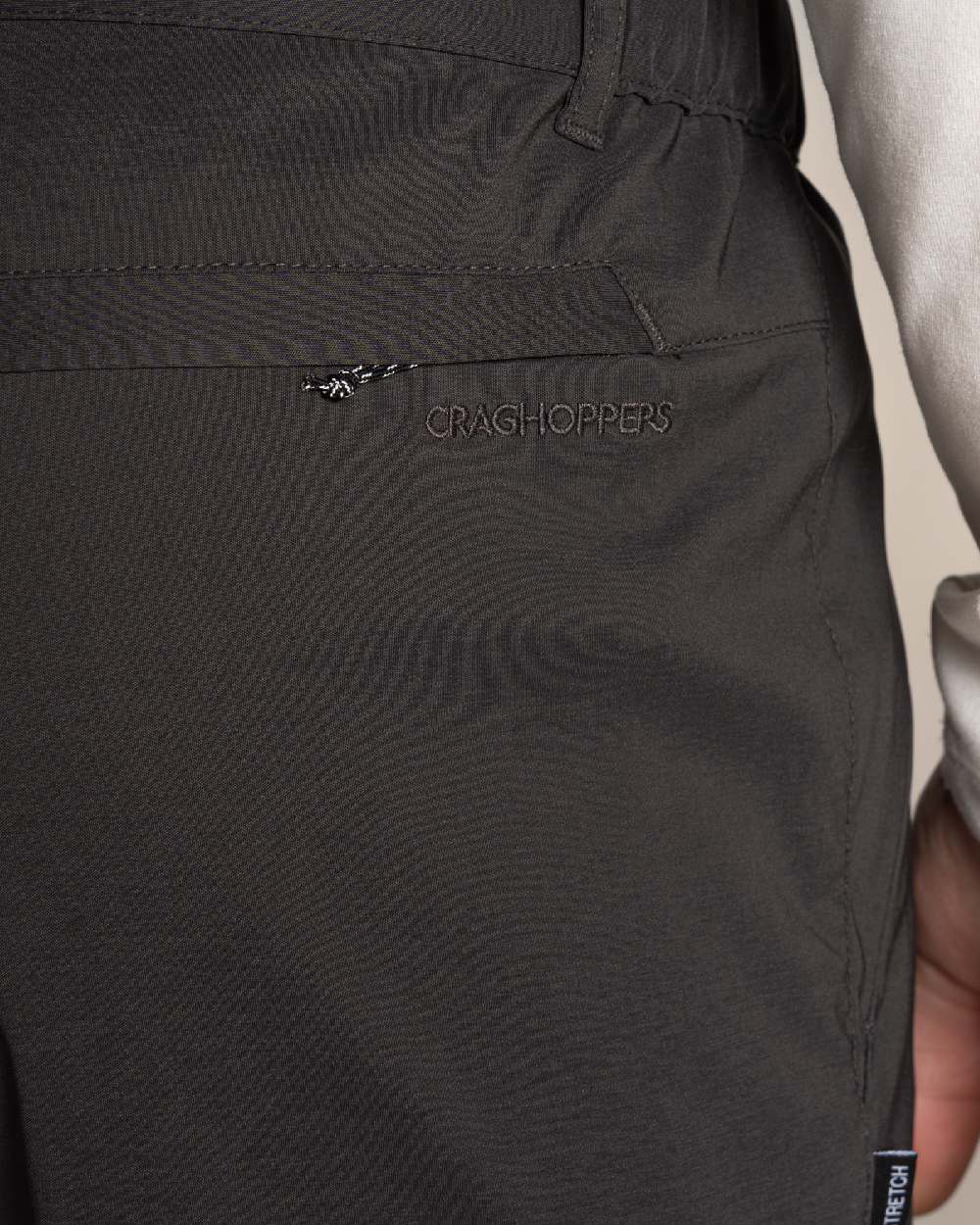 Dark Lead Coloured Craghoppers Mens Kiwi Pro III Convertible Trouser on Beige Background 