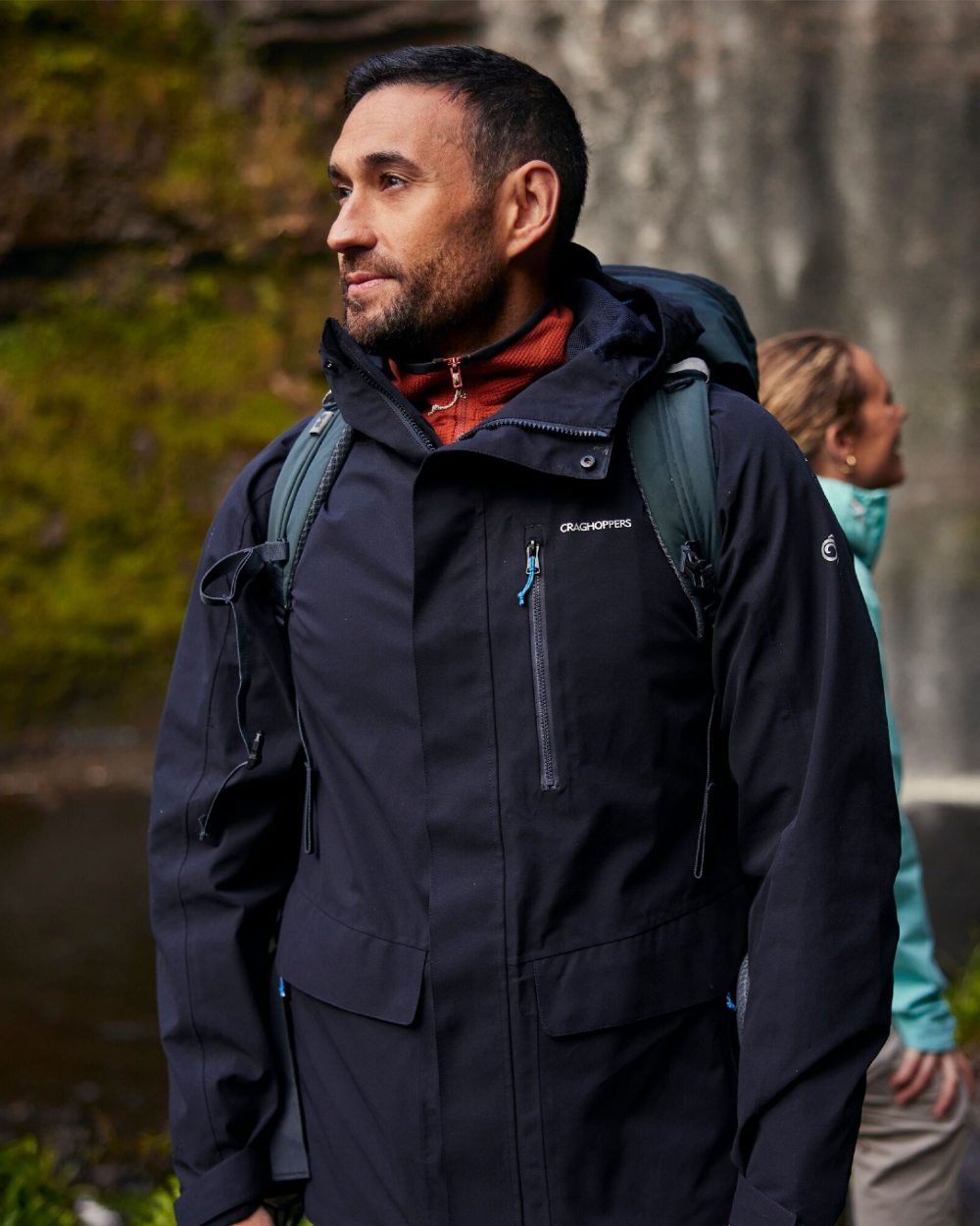 Dark Navy coloured Craghoppers Mens Lorton II Waterproof Jacket on waterfall background 