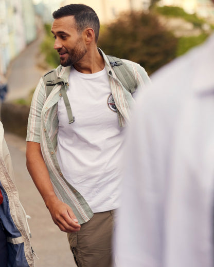 Optic White Coloured Craghoppers Mens Lucent II Short Sleeved T-Shirt on blurry Background
