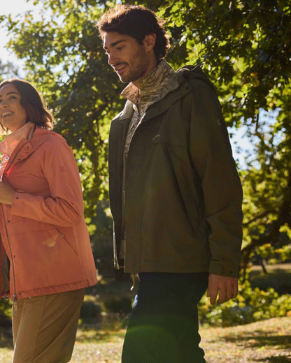 Dark Sage coloured Craghoppers Mens National Trust Keskadale Waterproof Jacket on forest background 