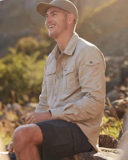 Parchment Craghoppers Mens NosiLife Adventure Long Sleeved Shirt III on forest background 
