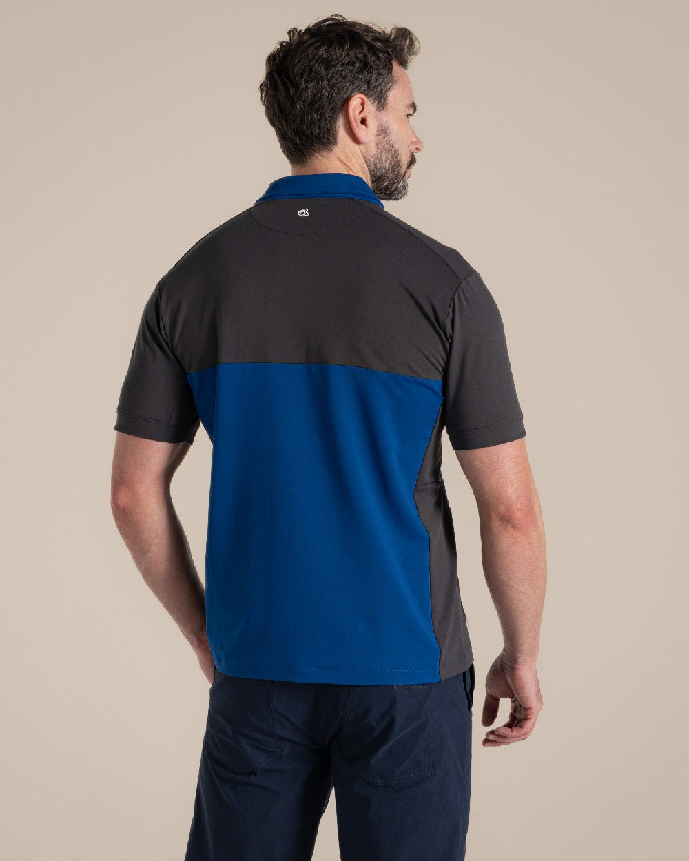 Dark Iron Deep Marina Coloured Craghoppers Mens Nosilife Avro Polo Top on Beige Background 