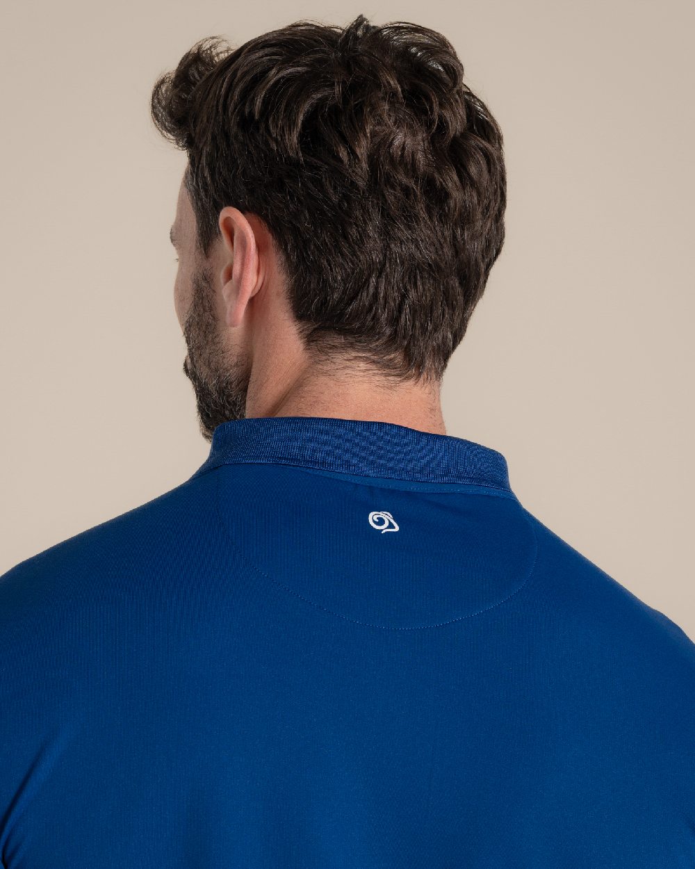 Deep Marina Coloured Craghoppers mens Nosilife Bramshaw Long Sleeved Polo Top on Beige Background 
