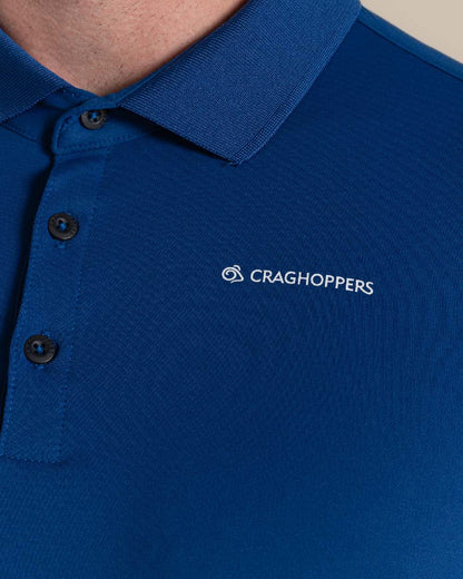 Deep Marina Coloured Craghoppers mens Nosilife Bramshaw Long Sleeved Polo Top on Beige Background 