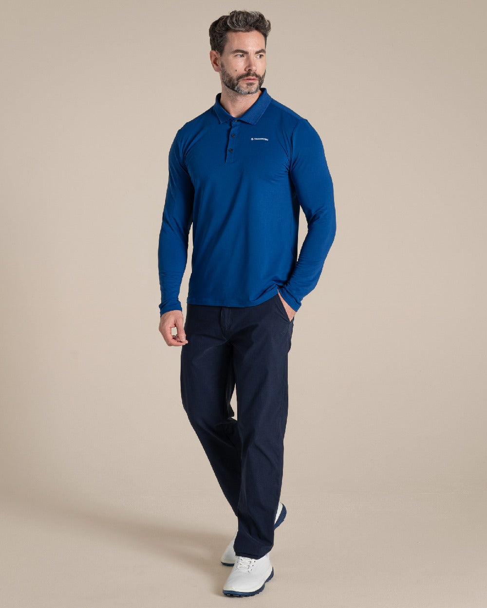 Deep Marina Coloured Craghoppers mens Nosilife Bramshaw Long Sleeved Polo Top on Beige Background 