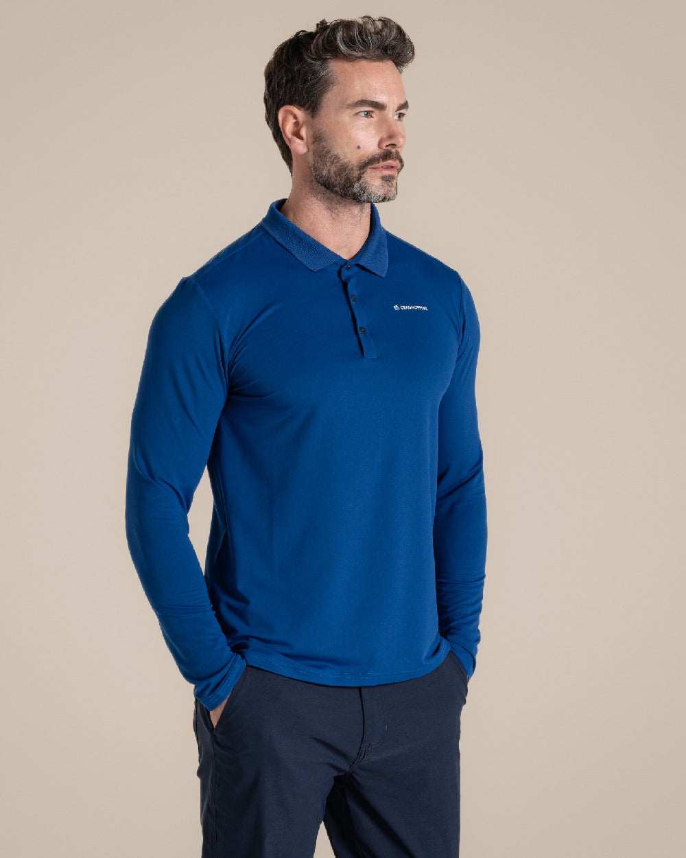 Deep Marina Coloured Craghoppers mens Nosilife Bramshaw Long Sleeved Polo Top on Beige Background 