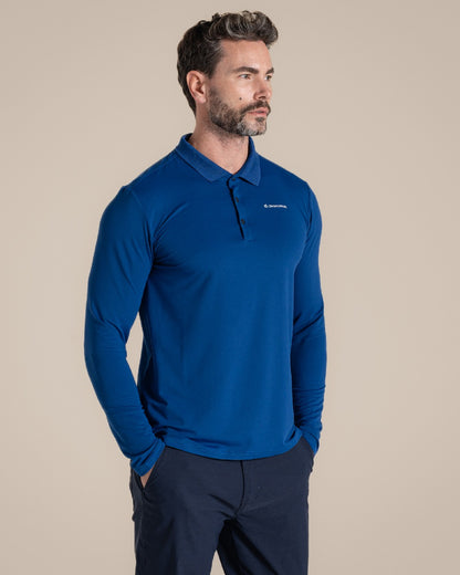 Deep Marina Coloured Craghoppers mens Nosilife Bramshaw Long Sleeved Polo Top on Beige Background 