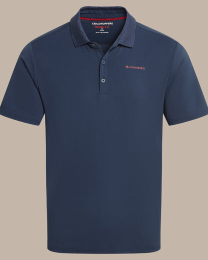 Blue Navy Coloured Craghoppers Mens Nosilife Bramshaw Short Sleeved Polo Top on Beige Background 