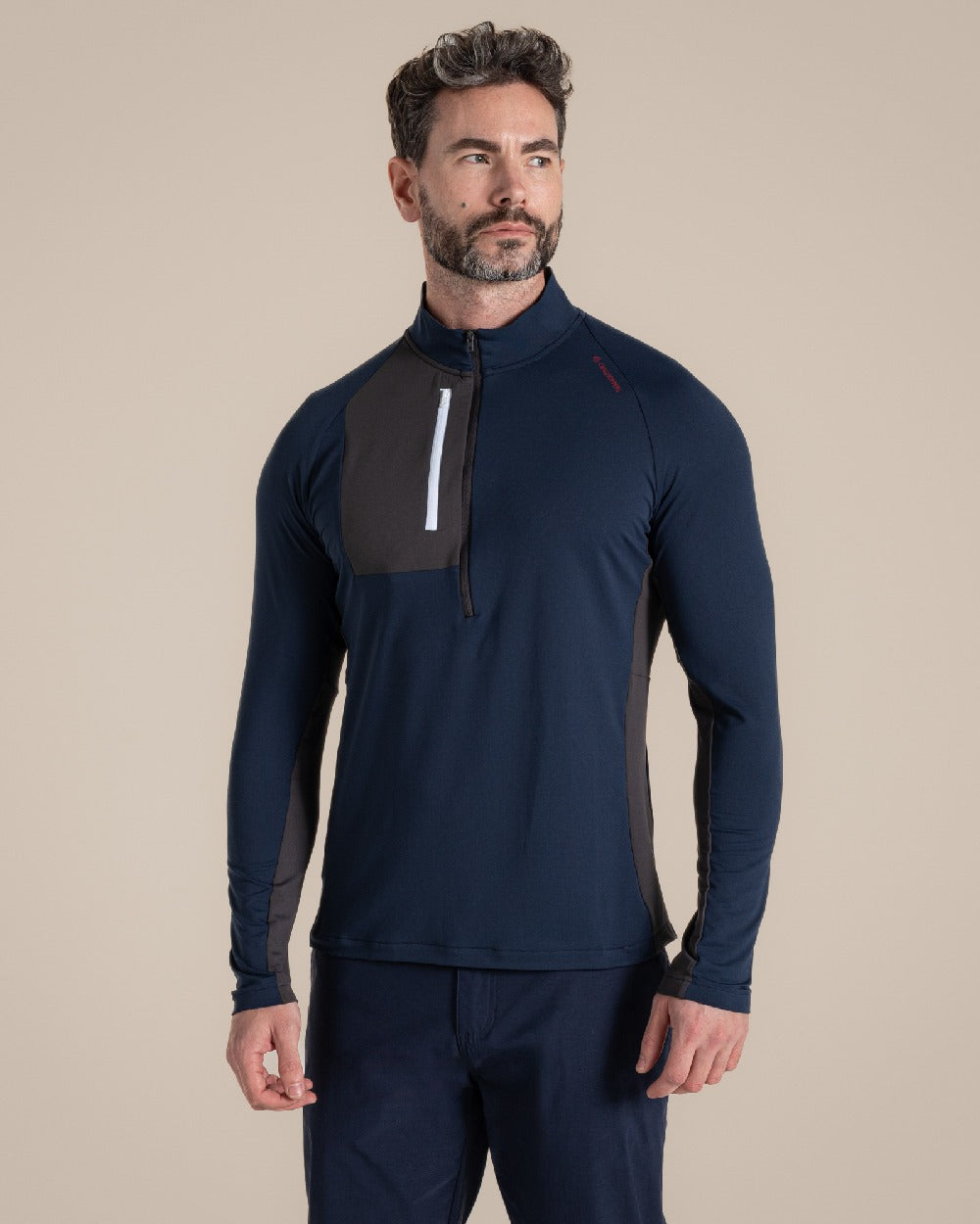 Blue Navy Coloured Craghoppers Mens Nosilife Goswick Half Zip Top on Beige Background 