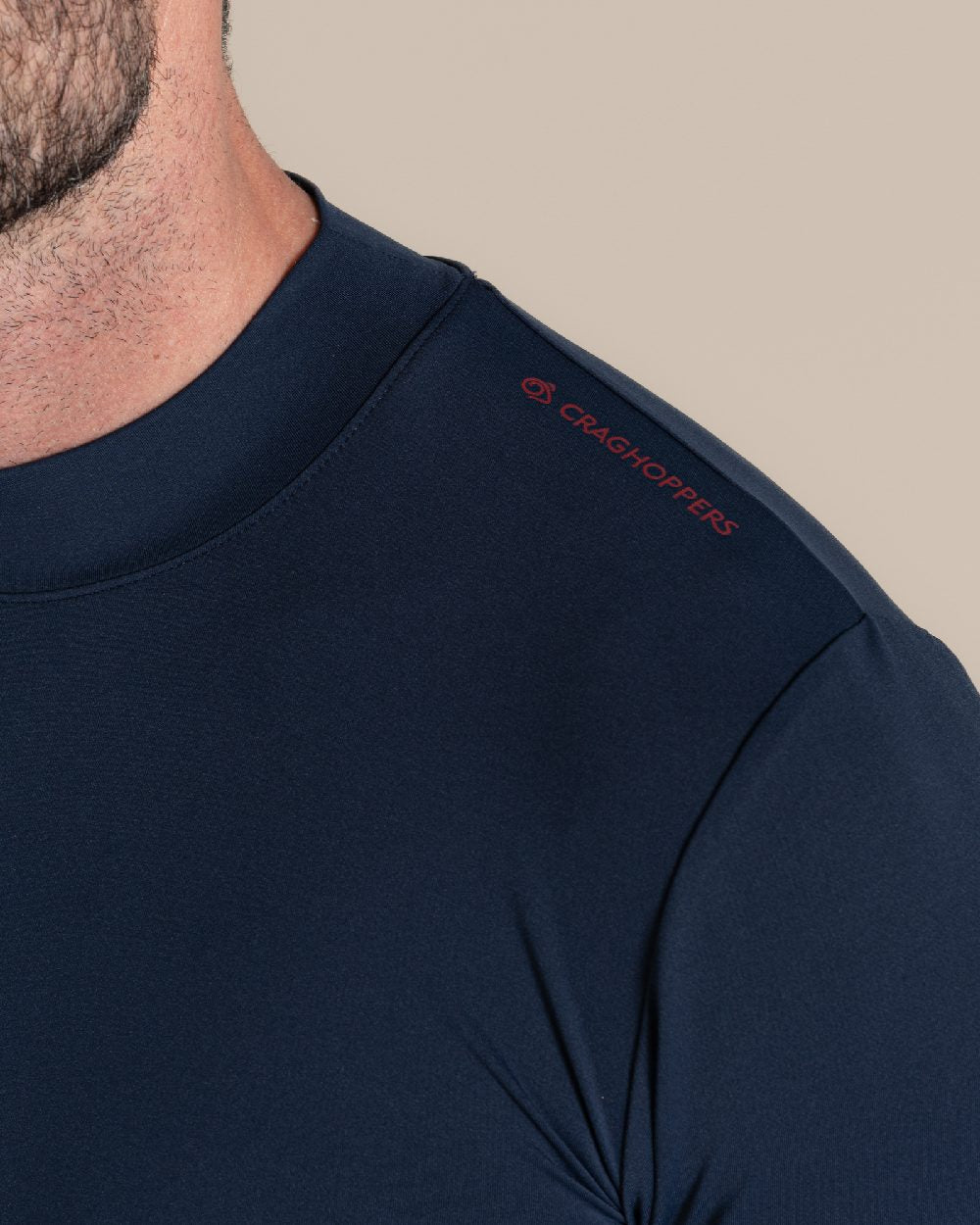 Blue Navy Coloured Craghoppers Mens Nosilife Long Sleeved Neck Top on Beige Background 