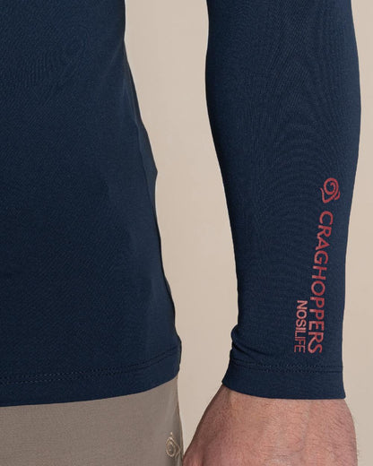 Blue Navy Coloured Craghoppers Mens Nosilife Long Sleeved Neck Top on Beige Background 