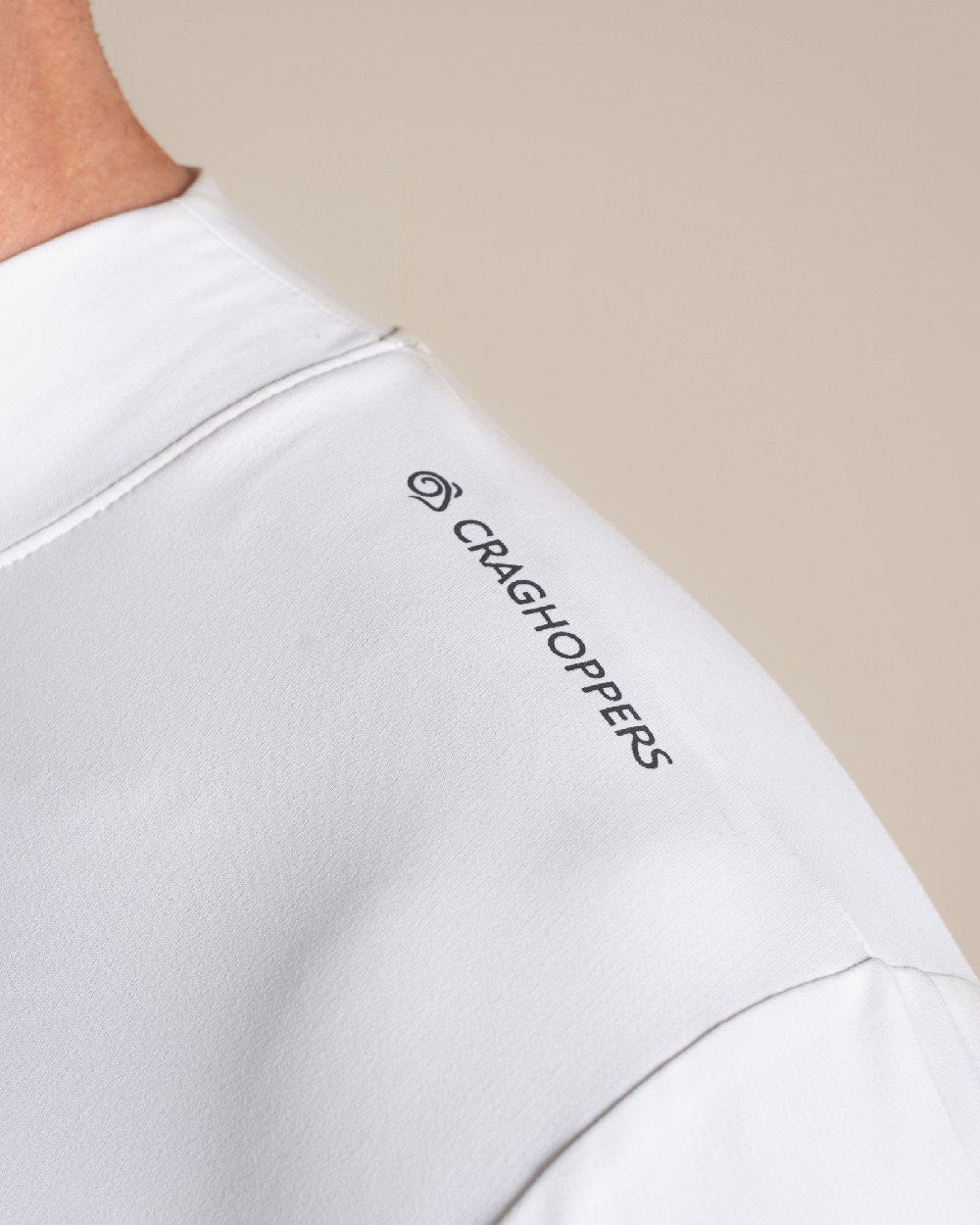 White Coloured Craghoppers Mens Nosilife Long Sleeved Neck Top on Beige Background 