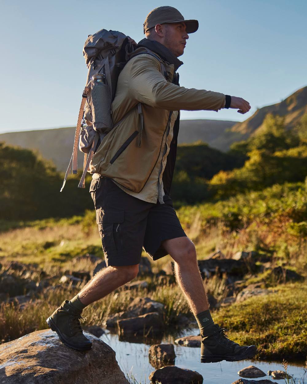 Black Pepper coloured Craghoppers Mens NosiLife Pro Convertible Trouser III on mountain background 