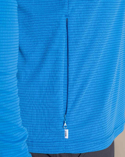 Azure Sky coloured Craghoppers Mens NosiLife SolarShield+ Half Zip Top on beige background 