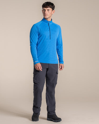 Azure Sky coloured Craghoppers Mens NosiLife SolarShield+ Half Zip Top on beige background 