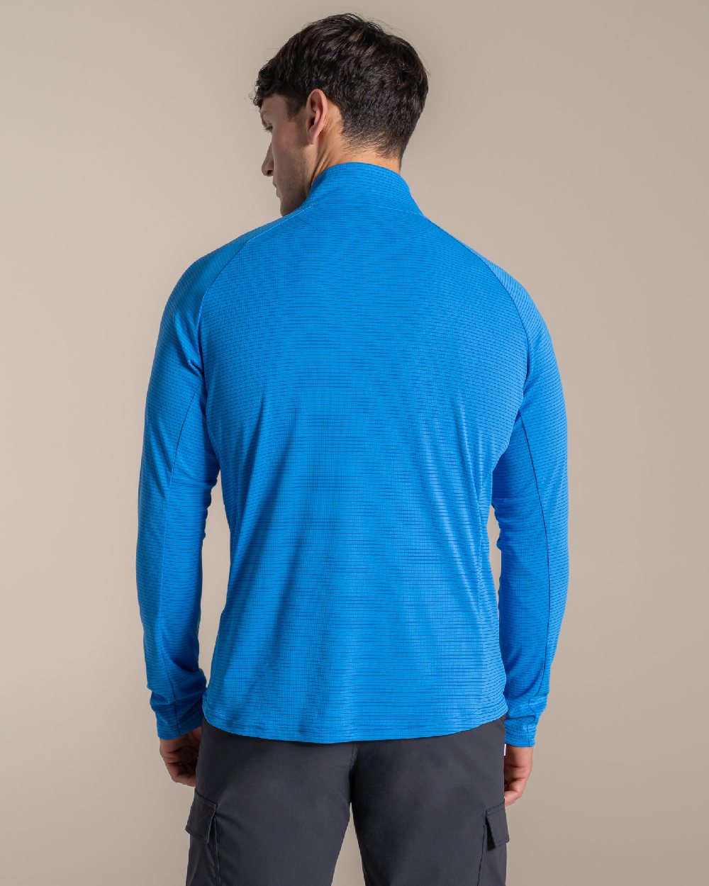 Azure Sky coloured Craghoppers Mens NosiLife SolarShield+ Half Zip Top on beige background 