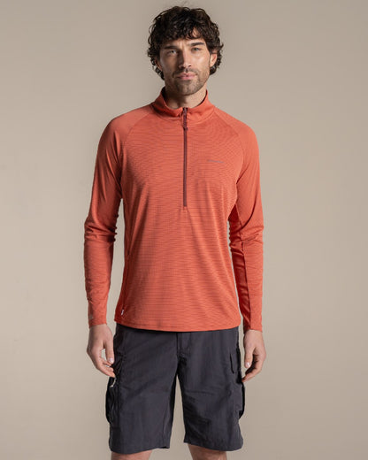 Dark Sahara coloured Craghoppers Mens NosiLife SolarShield+ Half Zip Top on beige background 