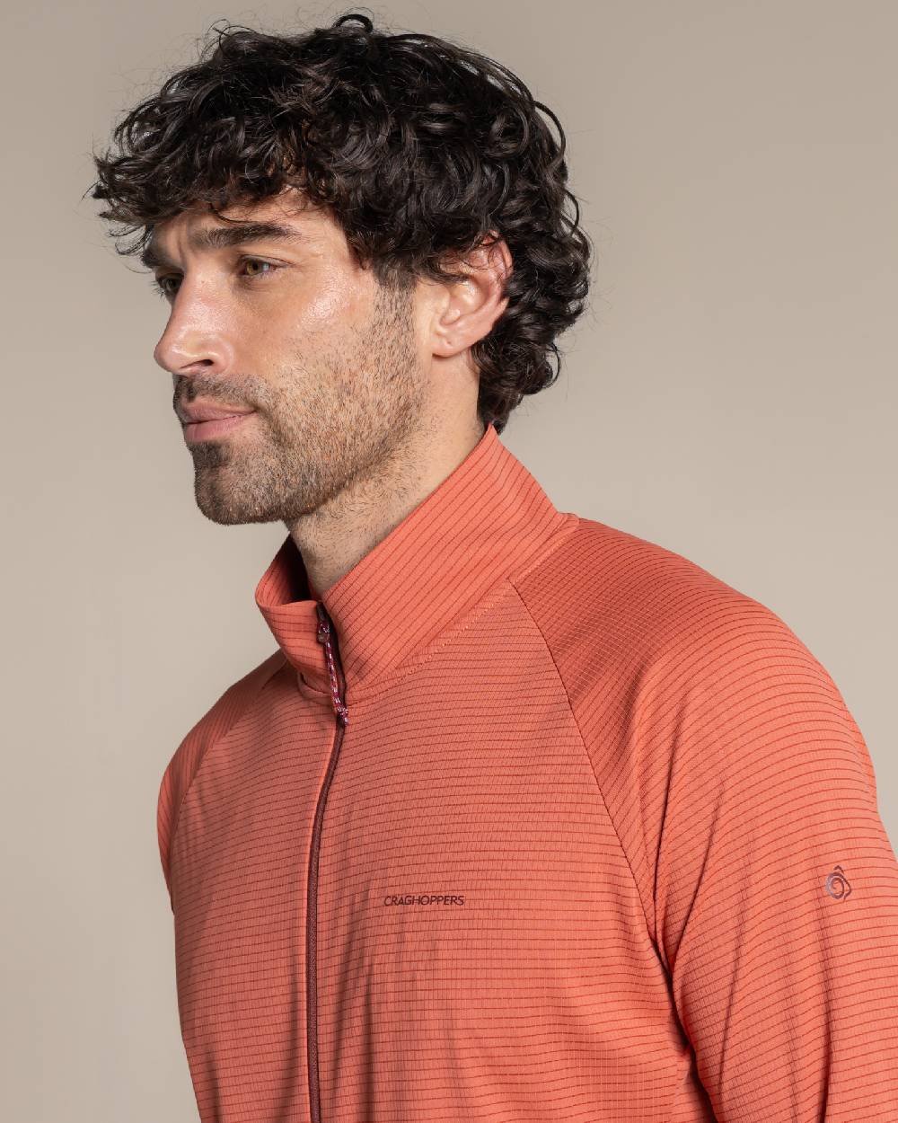 Dark Sahara coloured Craghoppers Mens NosiLife SolarShield+ Half Zip Top on beige background 