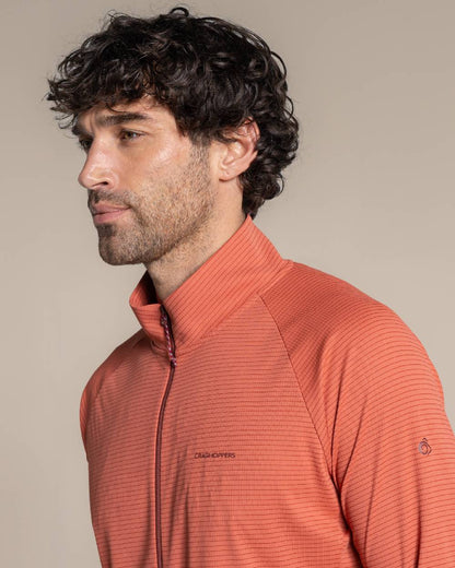 Dark Sahara coloured Craghoppers Mens NosiLife SolarShield+ Half Zip Top on beige background 