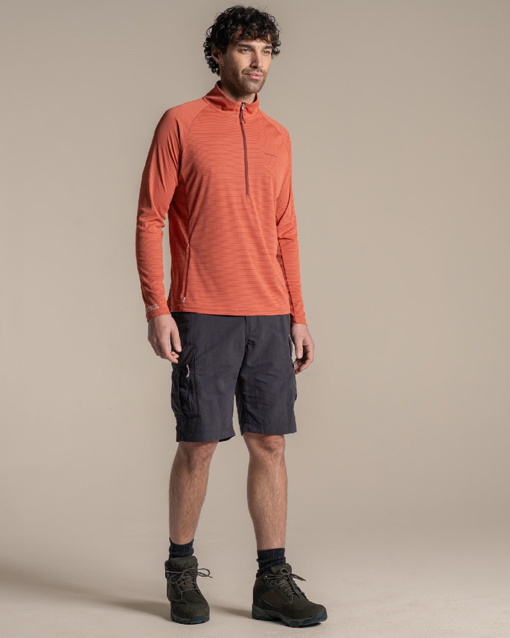 Dark Sahara coloured Craghoppers Mens NosiLife SolarShield+ Half Zip Top on beige background 