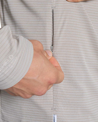 Parchment coloured Craghoppers Mens NosiLife SolarShield+ Half Zip Top on white background 