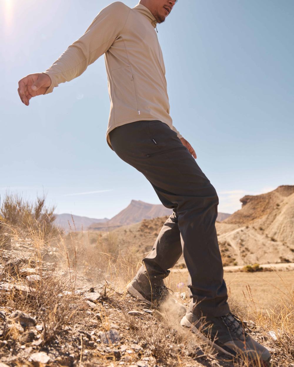 Parchment coloured Craghoppers Mens NosiLife SolarShield+ Half Zip Top on mountain background 