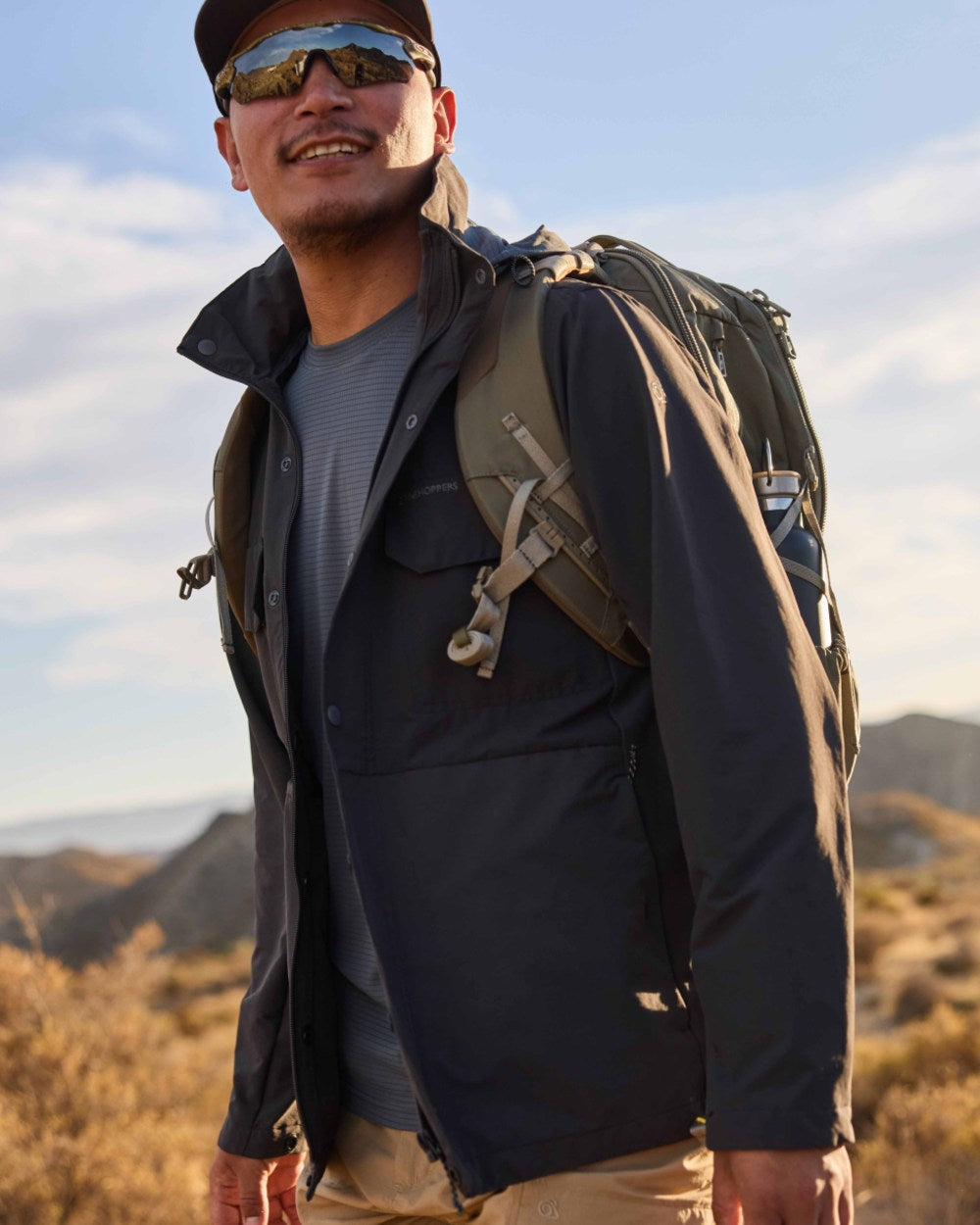 Dark Pewter coloured Craghoppers Mens NosiLife SolarShield+ Long Sleeved T-Shirt on mountain background 