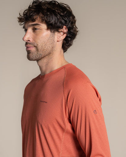 Dark Sahara coloured Craghoppers Mens NosiLife SolarShield+ Long Sleeved T-Shirt on beige background 