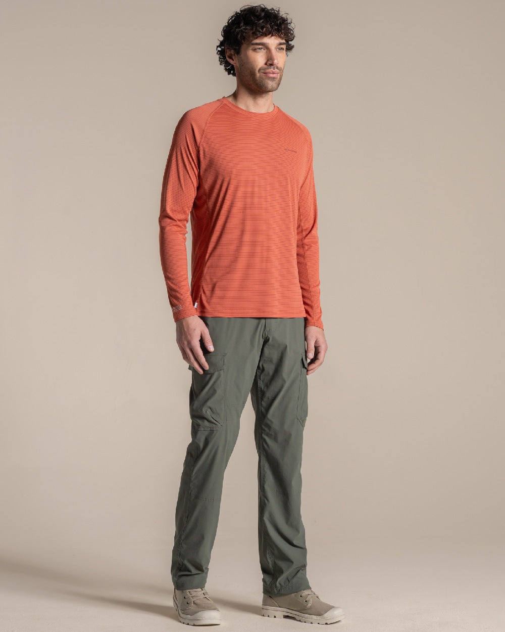 Dark Sahara coloured Craghoppers Mens NosiLife SolarShield+ Long Sleeved T-Shirt on beige background 