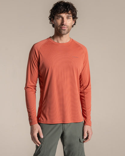 Dark Sahara coloured Craghoppers Mens NosiLife SolarShield+ Long Sleeved T-Shirt on beige background 