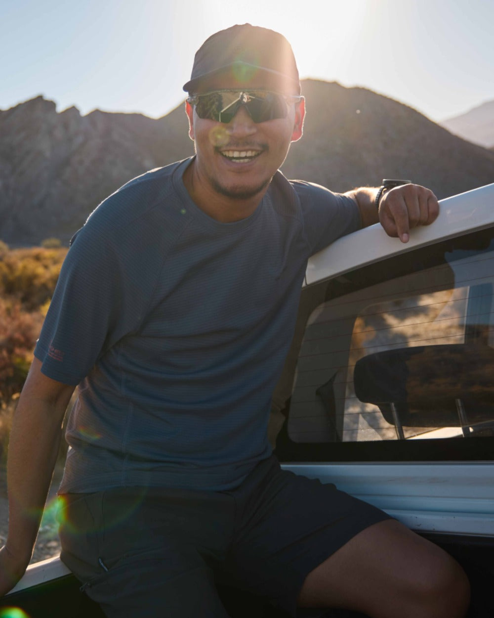 Dark Pewter coloured Craghoppers Mens NosiLife SolarShield+ Short Sleeved T-Shirt on mountain background 